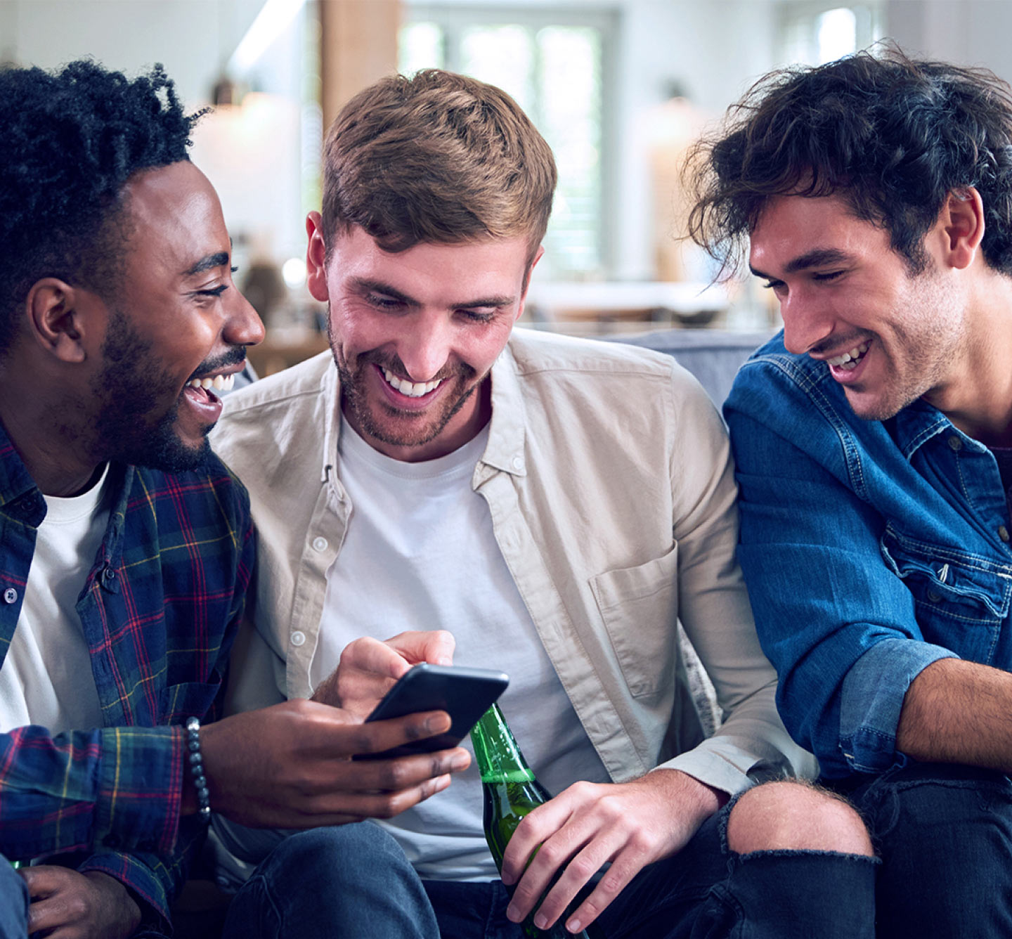 3 bros watching game on mobile phone